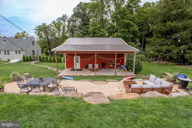 view of yard with a patio area and an outbuilding