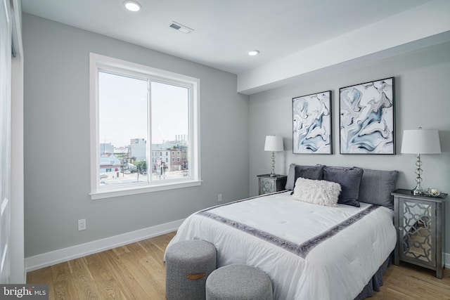 bedroom with light hardwood / wood-style flooring