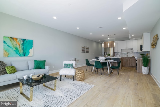 living room with light hardwood / wood-style floors