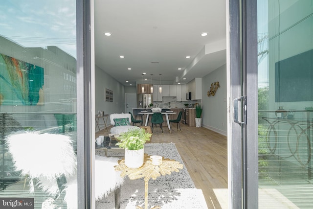 dining space with light hardwood / wood-style floors