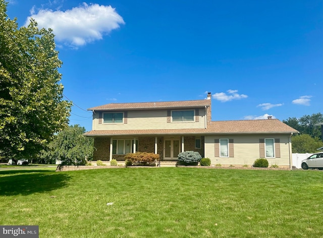 view of front of home with a front yard