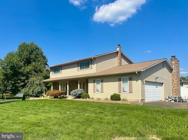 view of front of property featuring a garage and a front yard