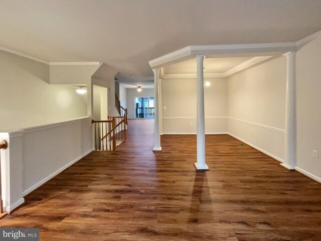 interior space featuring hardwood / wood-style floors, ornamental molding, and ornate columns