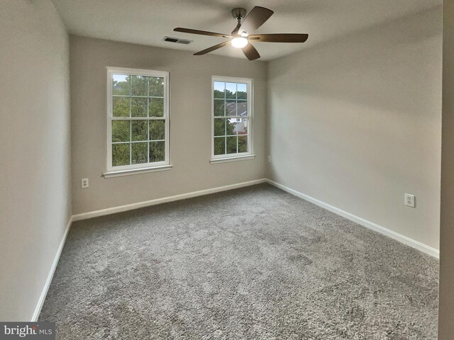 unfurnished room with ceiling fan and carpet floors