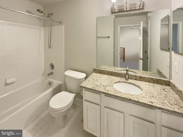 full bathroom featuring tile patterned flooring, vanity, bathing tub / shower combination, and toilet