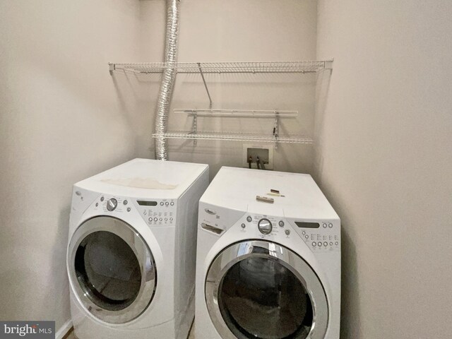 laundry room with washer and dryer