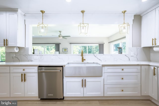 kitchen featuring dishwasher, light stone countertops, white cabinets, and pendant lighting