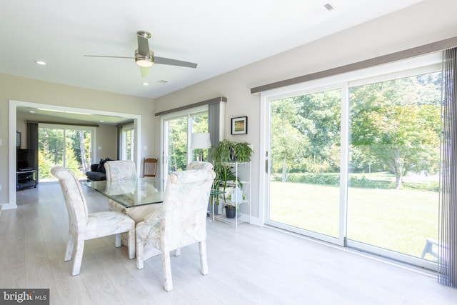 dining area featuring a healthy amount of sunlight, light wood-type flooring, a ceiling fan, and recessed lighting