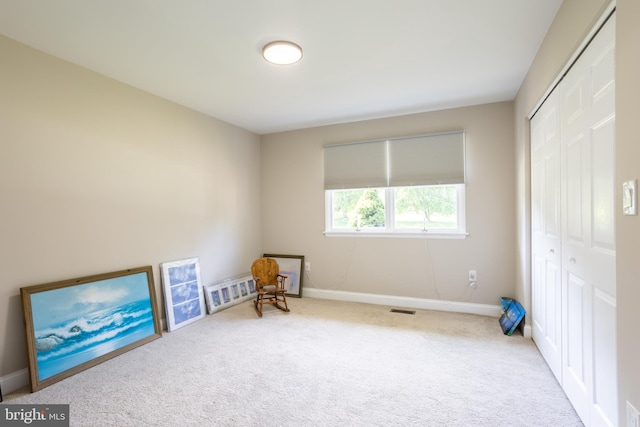 miscellaneous room featuring carpet, visible vents, and baseboards