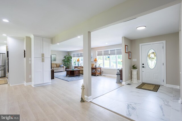 foyer entrance featuring light hardwood / wood-style floors