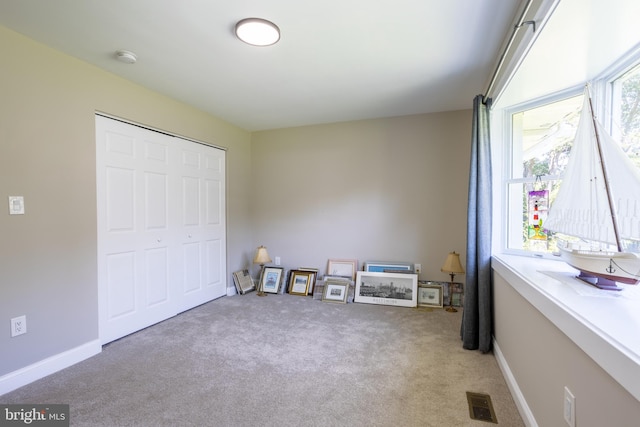 bedroom featuring a closet and carpet floors