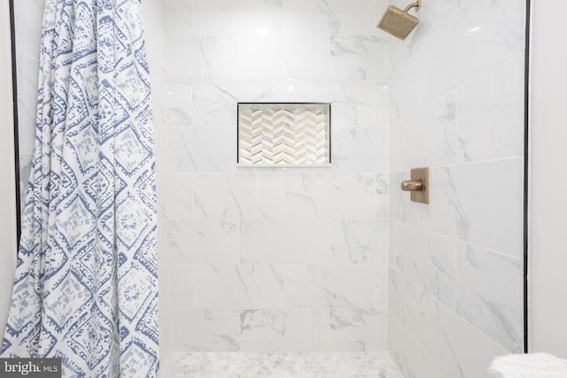 bathroom with a shower with shower curtain