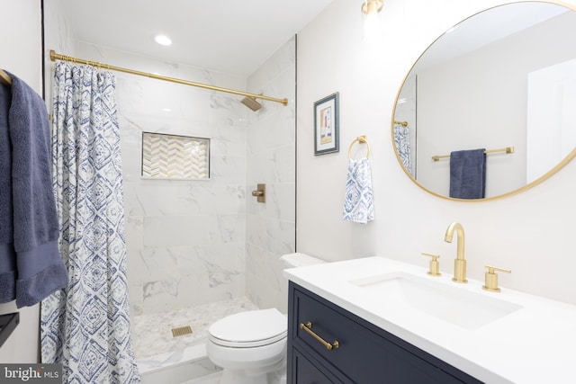 full bath featuring toilet, marble finish floor, a stall shower, and vanity