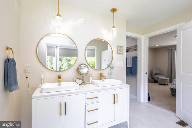 bathroom featuring tile patterned flooring and vanity