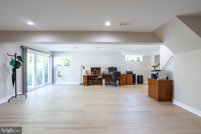 unfurnished office featuring light wood-style floors, baseboards, visible vents, and recessed lighting