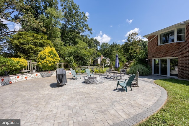 view of patio / terrace with a fire pit