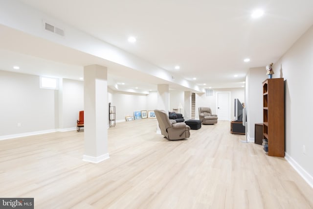 below grade area with recessed lighting, visible vents, stairway, light wood-type flooring, and baseboards