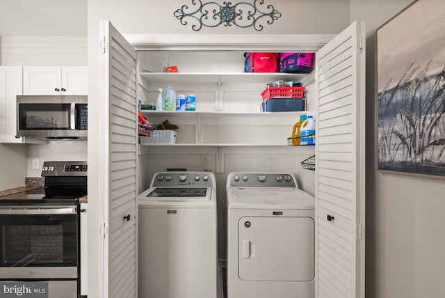 laundry room featuring independent washer and dryer