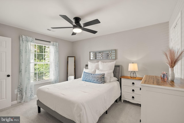 carpeted bedroom with ceiling fan