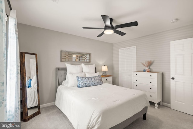 bedroom featuring ceiling fan and light colored carpet