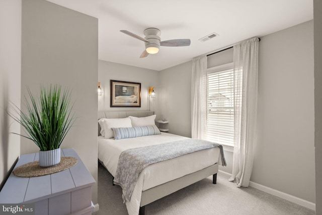 bedroom with light colored carpet and ceiling fan