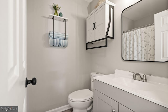 bathroom with vanity and toilet