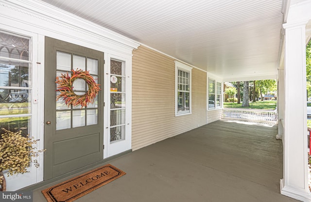 property entrance with covered porch