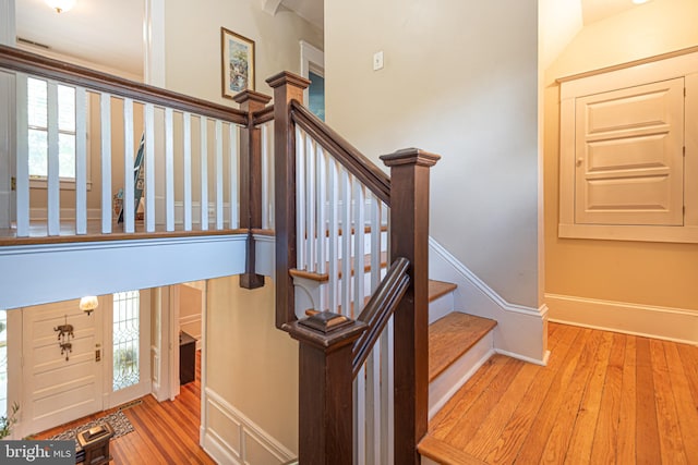 stairway featuring wood-type flooring