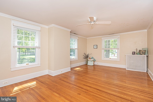 unfurnished living room featuring ornamental molding, light hardwood / wood-style flooring, and ceiling fan