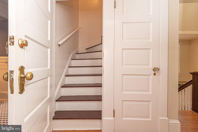 stairway with wood-type flooring