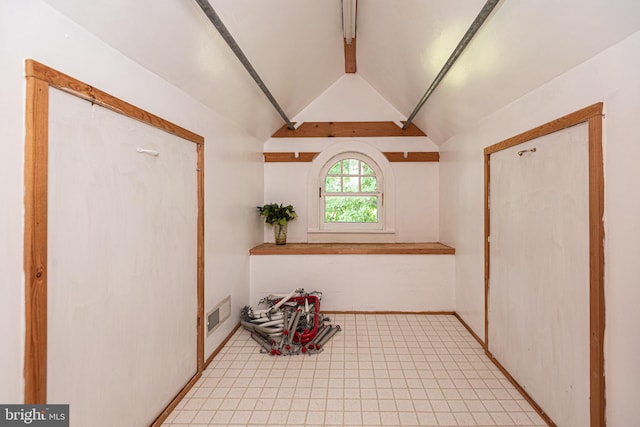 foyer featuring lofted ceiling