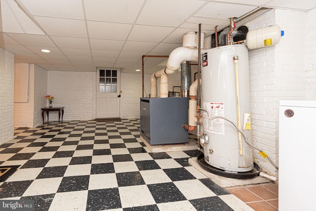 utility room with heating unit and water heater