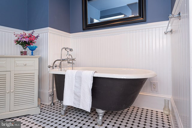 bathroom featuring a bath and tile patterned flooring