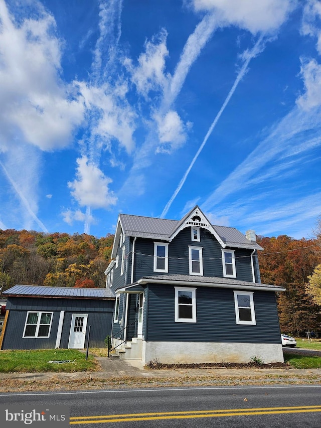 view of front of house featuring metal roof