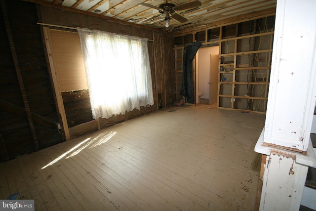 misc room with ceiling fan and wood finished floors