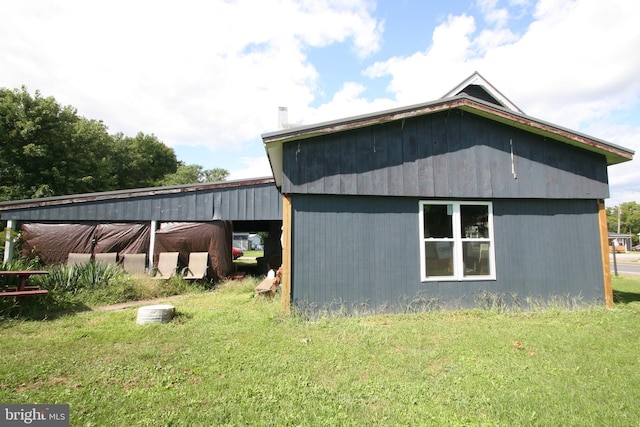 view of outbuilding featuring an outbuilding and a carport