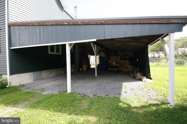 view of vehicle parking with a carport