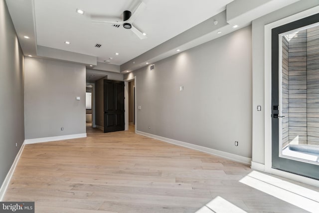 spare room featuring ceiling fan and light hardwood / wood-style floors