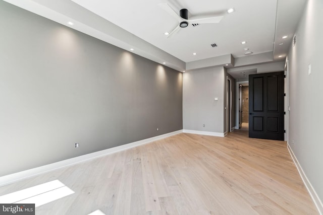 empty room with light wood-type flooring and ceiling fan