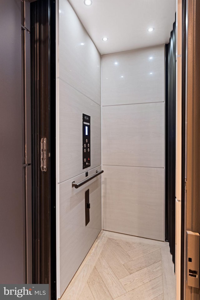 room details featuring recessed lighting and elevator