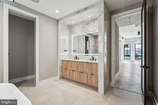 bathroom featuring vanity, a bathtub, and hardwood / wood-style floors