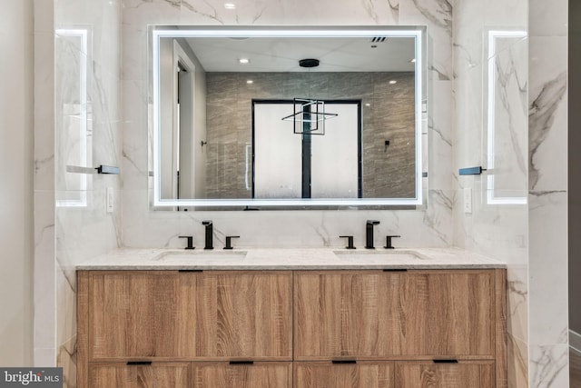 bathroom with tile walls and vanity