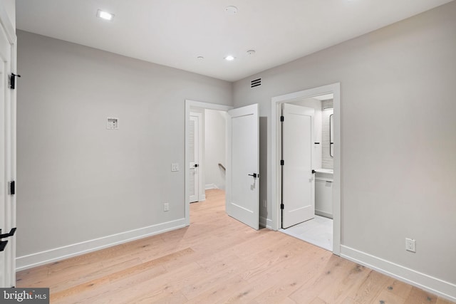 unfurnished bedroom featuring recessed lighting, visible vents, light wood-style flooring, and baseboards