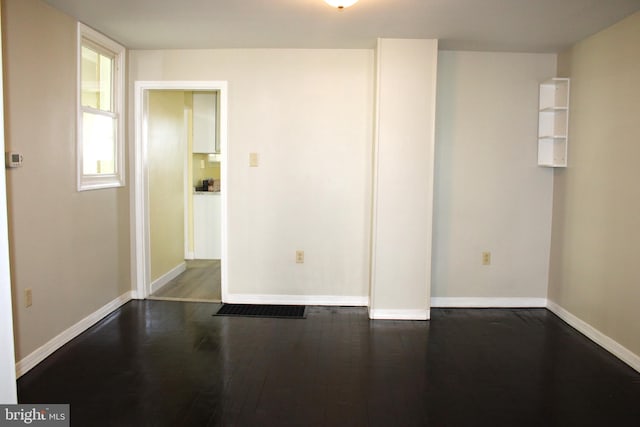 unfurnished room featuring wood-type flooring