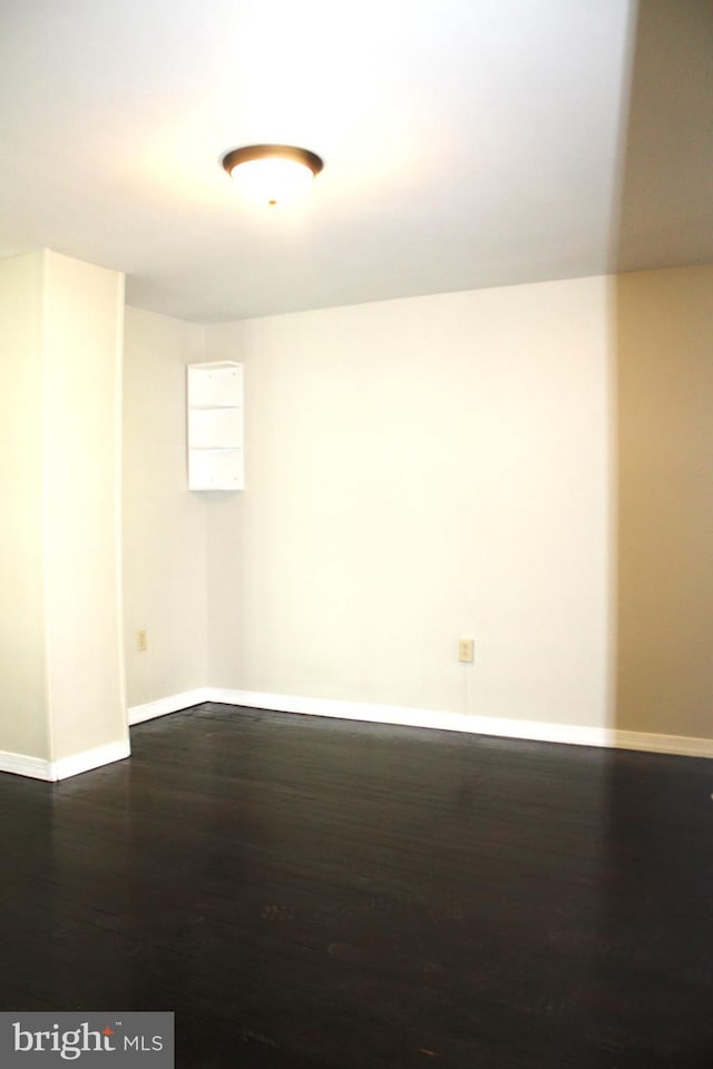 empty room with wood-type flooring