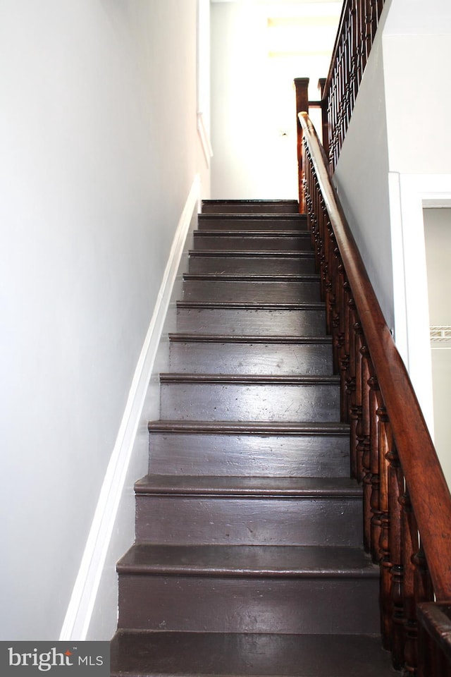 staircase with baseboards