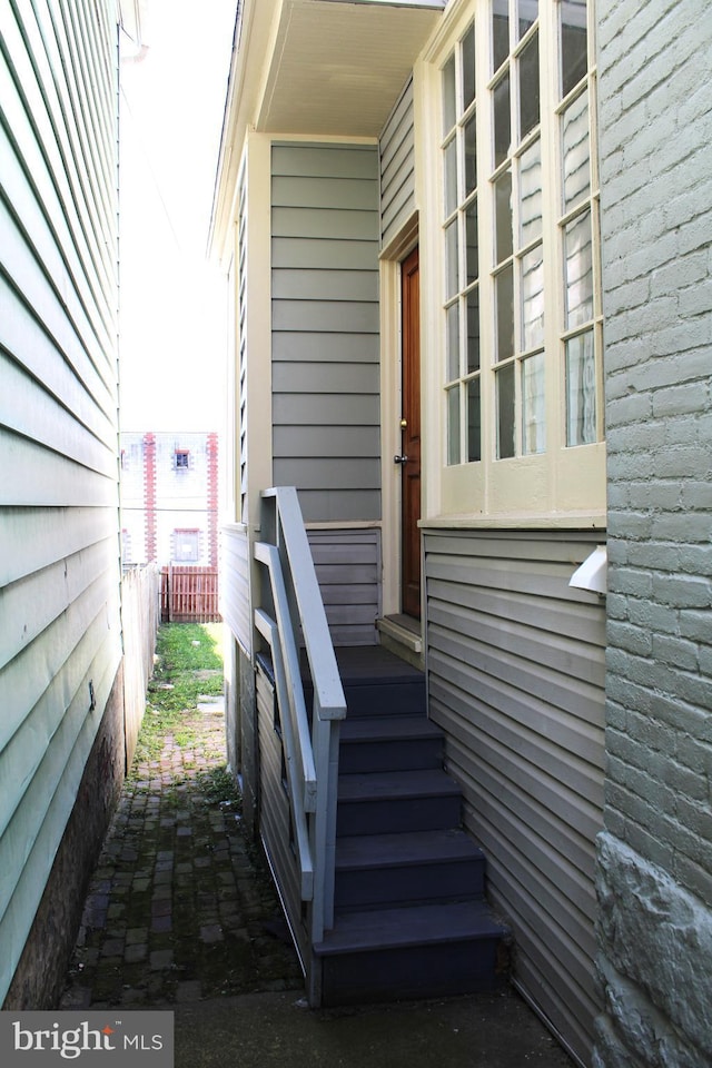 property entrance with brick siding