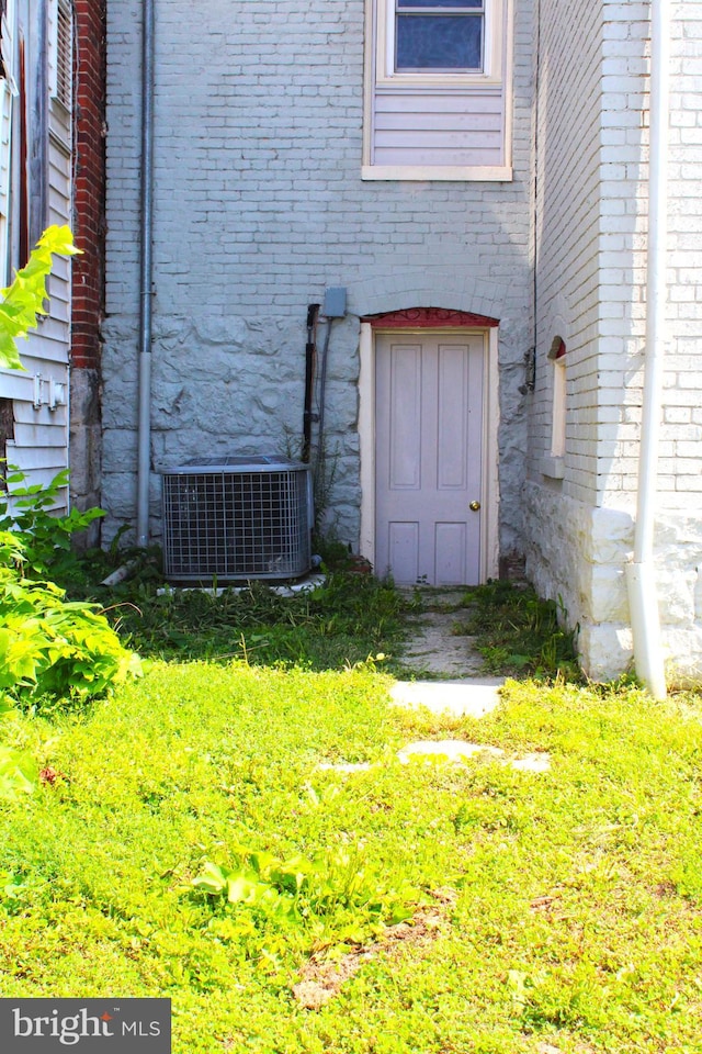 view of yard featuring central air condition unit