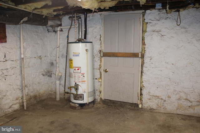 utility room with gas water heater