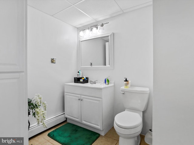 bathroom featuring tile patterned floors, vanity, toilet, and a baseboard radiator